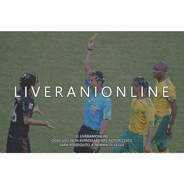 (100611) -- JOHANNESBURG, June 11, 2010 () -- Referee Ravshan Irmatov of Uzbekistan (2nd L) shows the yellow card to Mexico\'s Efrain Juarez (1st L) during a group A match of the 2010 FIFA World Cup between South Africa and Mexico at Soccer City stadium in Soweto, suburban Johannesburg, on June 11, 2010. The match ended with a 1-1 tie. (/Li Ga) (kh) ©Photoshot/Agenzia Aldo Liverani Sas - ITALY ONLY: SUDAFRICA - MESSICO FIFA WORLD CUP CAMPIONATI MONDIALI SUD AFRICA 2010