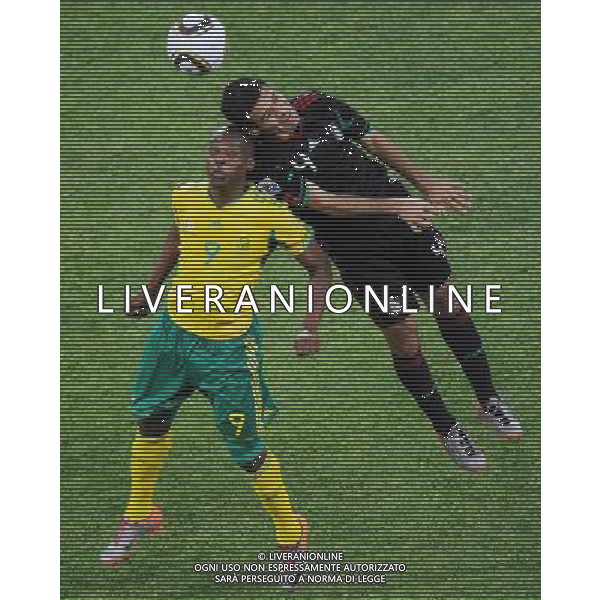 (100611) -- JOHANNESBURG, June 11, 2010 () -- South Africa\'s Katlego Mphela (L) vies with Mexico\'s Rafael Marquez during a group A match of the 2010 FIFA World Cup at Soccer City stadium in Soweto, suburban Johannesburg, on June 11, 2010. The match ended with a 1-1 tie. (/Li Ga) (ly) ©Photoshot/Agenzia Aldo Liverani Sas - ITALY ONLY: SUDAFRICA - MESSICO FIFA WORLD CUP CAMPIONATI MONDIALI SUD AFRICA 2010