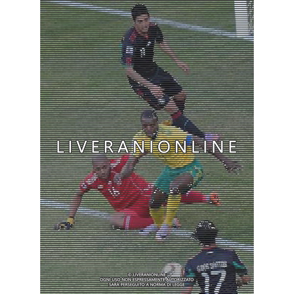 (100611) -- JOHANNESBURG, June 11, 2010 () -- South Africa\'s goalkeeper Itumeleng Khune (L) and his teammate Aaron Mokoena (C) defend Mexico\'s Giovani Dos Santos (Bottom) during a group A match of the 2010 FIFA World Cup at Soccer City stadium in Soweto, suburban Johannesburg, on June 11, 2010. The match ended with a 1-1 tie. (/Li Ga) (ly) ©Photoshot/Agenzia Aldo Liverani Sas - ITALY ONLY: SUDAFRICA - MESSICO FIFA WORLD CUP CAMPIONATI MONDIALI SUD AFRICA 2010