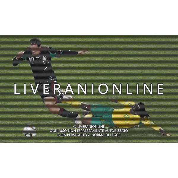 (100611) -- JOHANNESBURG, June 11, 2010 () -- Reneilwe Letsholonyane (R) of South Africa vies with Cuauhtemoc Blanco of Mexico during a group A match of the 2010 FIFA World Cup at Soccer City stadium in Soweto, suburban Johannesburg, on June 11, 2010. The match ended with a 1-1 tie. (/Li Ga) (ly) ©Photoshot/Agenzia Aldo Liverani Sas - ITALY ONLY: SUDAFRICA - MESSICO FIFA WORLD CUP CAMPIONATI MONDIALI SUD AFRICA 2010