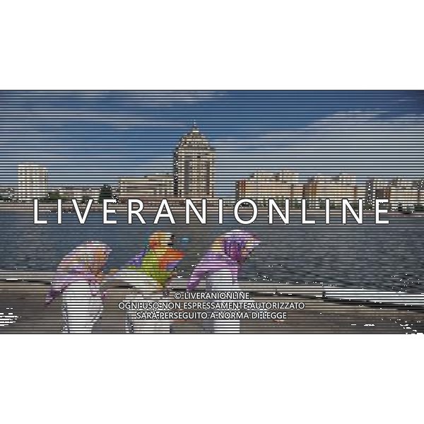 (100613) -- ASTANA, June 13, 2010 () -- Women walk on the bank of the Ishim River in Astana, capital of Kazakhstan. Astana, which literally means capital in Kazakh, has taken the place of Almaty as the new capital since December 1997. (/Sadat) - Xinhua/Photoshot - Ag. Aldo Liverani sas ITALY ONLY VEDUTE DI ASTANA - CAPITALE DEL KAZAKISTAN