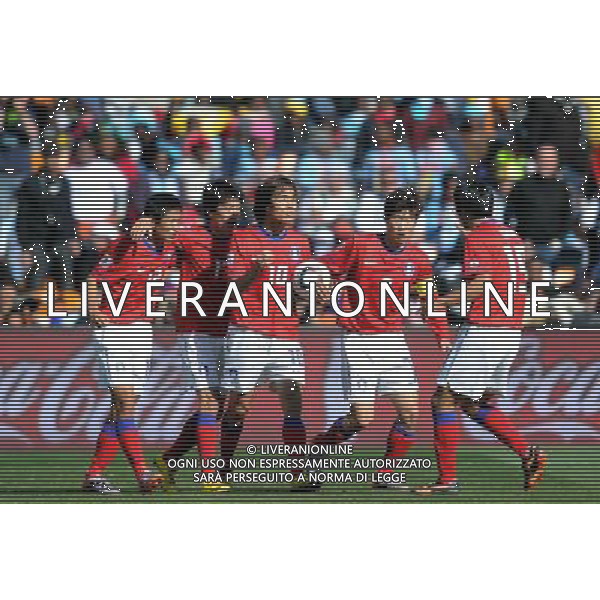 (100617) -- JOHANNESBURG, June 17, 2010 -- South Korea\'s players celebrate scoring during a 2010 World Cup Group B match between Argentina and South Korea at the Soccer City stadium in Soweto, suburban Johannesburg, South Africa, on June 17, 2010. Wang Yuguo) (zc) ©Photoshot/Agenzia Aldo Liverani Sas - ITALY ONLY - ARGENTINA - COREA DEL SUD FIFA WORLD CUP CAMPIONATI MONDIALI SUD AFRICA 2010