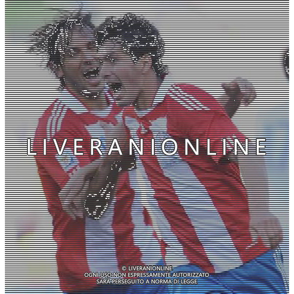 (100620) -- BLOEMFONTEIN, June 20, 2010 () -- Paraguay\'s Cristian Riveros (R) celebrates his scoring during the 2010 World Cup Group F football match against Slovakia at Free State Stadium in Bloemfontein, South Africa, on June 20, 2010. Paraguay won 2-0. (/Li Ga)(kh) ©Photoshot/Agenzia Aldo Liverani Sas - ITALY ONLY: PARAGUAY - SLOVACCHIA FIFA WORLD CUP CAMPIONATI MONDIALI SUD AFRICA 2010