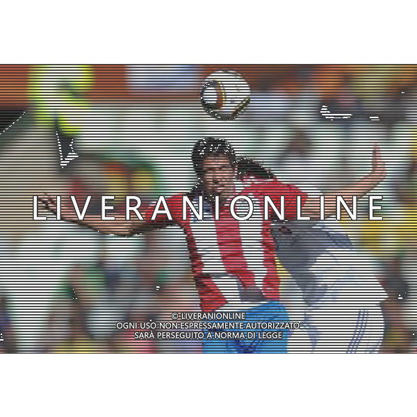 (100620) -- BLOEMFONTEIN, June 20, 2010 () -- Paraguay\'s Victor Caceres (L) vies for the ball during the 2010 World Cup Group F football match gainst Slovakia at Free State Stadium in Bloemfontein, South Africa, on June 20, 2010. (/Li Ga)(kh) ©Photoshot/Agenzia Aldo Liverani Sas - ITALY ONLY: PARAGUAY - SLOVACCHIA FIFA WORLD CUP CAMPIONATI MONDIALI SUD AFRICA 2010