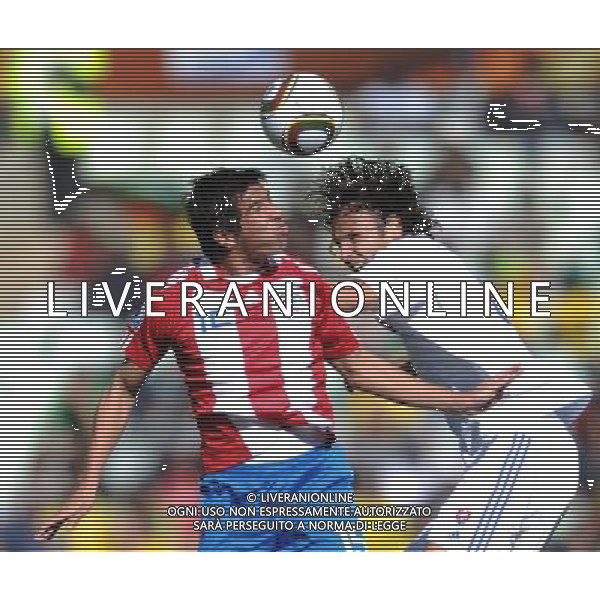 (100620) -- BLOEMFONTEIN, June 20, 2010 () -- Paraguay\'s Victor Caceres (L) vies for the ball during the 2010 World Cup Group F football match gainst Slovakia at Free State Stadium in Bloemfontein, South Africa, on June 20, 2010. (/Li Ga)(kh) ©Photoshot/Agenzia Aldo Liverani Sas - ITALY ONLY: PARAGUAY - SLOVACCHIA FIFA WORLD CUP CAMPIONATI MONDIALI SUD AFRICA 2010