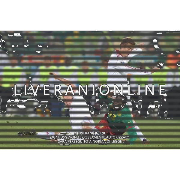 (100620) -- TSHWANE, June 20, 2010 () --Cameroon\'s Vincent Aboubakar (C) breaks through the defence of Denmark\'s Simon Kjaer (L) and Jakob Poulsen during the 2010 World Cup Group E soccer match at Loftus Verfeld stadium in Tshwane, South Africa, on June 19, 2010. Denmark won 2-1. (/Yang Lei)(dl) ©Photoshot/Agenzia Aldo Liverani Sas - ITALY ONLY - CAMERUN - DANIMARCA FIFA WORLD CUP CAMPIONATI MONDIALI SUD AFRICA 2010