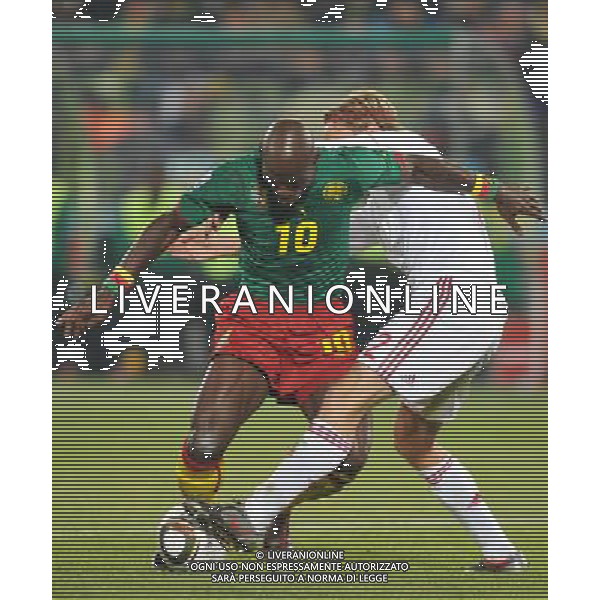 (100620) -- TSHWANE, June 20, 2010 () --Achille Emana of Cameroon(L) vies with Christian Bager Poulsen of Denmark during their 2010 World Cup Group E soccer match at Loftus Verfeld stadium in Tshwane, South Africa, on June 19,2010. Denmark won 2-1. (/Yang Lei)(dl) ©Photoshot/Agenzia Aldo Liverani Sas - ITALY ONLY - CAMERUN - DANIMARCA FIFA WORLD CUP CAMPIONATI MONDIALI SUD AFRICA 2010