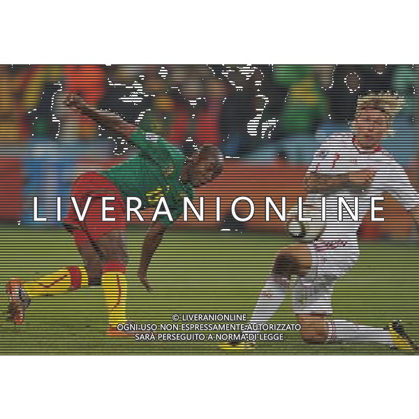 (100620) -- TSHWANE, June 20, 2010 () --Pierre Webo of Cameroon(L) vies with Simon Kjaer of Denmark during the 2010 World Cup Group E soccer match at Loftus Verfeld stadium in Tshwane, South Africa, on June 19, 2010. (/Yang Lei)(dl) ©Photoshot/Agenzia Aldo Liverani Sas - ITALY ONLY: CAMERUN - DANIMARCA FIFA WORLD CUP CAMPIONATI MONDIALI SUD AFRICA 2010