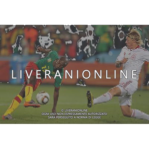 (100620) -- TSHWANE, June 20, 2010 () --Pierre Webo of Cameroon(L) vies with Simon Kjaer of Denmark during their 2010 World Cup Group E soccer match at Loftus Verfeld stadium in Tshwane, South Africa, on June 19, 2010. (/Yang Lei)(fym) ©Photoshot/Agenzia Aldo Liverani Sas - ITALY ONLY: CAMERUN - DANIMARCA FIFA WORLD CUP CAMPIONATI MONDIALI SUD AFRICA 2010