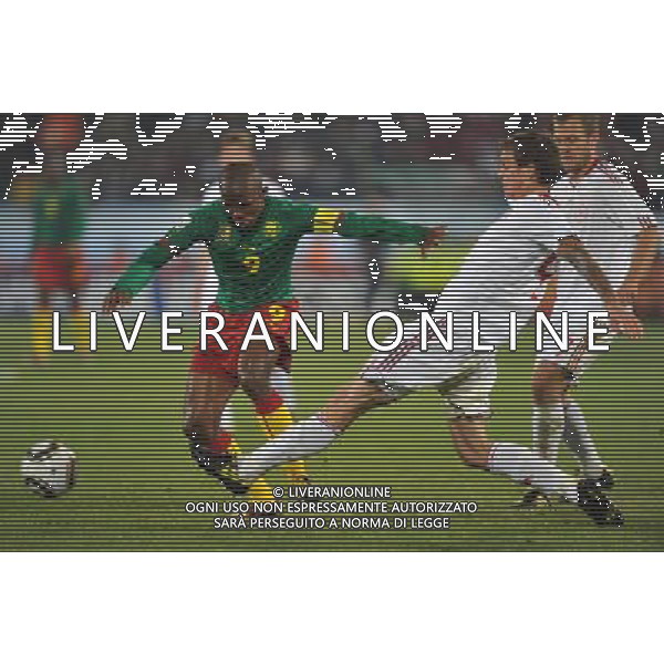 (100620) -- TSHWANE, June 20, 2010 () --Samuel Eto\'o of Cameroon(L) vies with Daniel Agger of Denmark during the 2010 World Cup Group E soccer match at Loftus Verfeld stadium in Tshwane, South Africa, on June 19, 2010. (/Yang Lei)(dl) ©Photoshot/Agenzia Aldo Liverani Sas - ITALY ONLY: CAMERUN - DANIMARCA FIFA WORLD CUP CAMPIONATI MONDIALI SUD AFRICA 2010