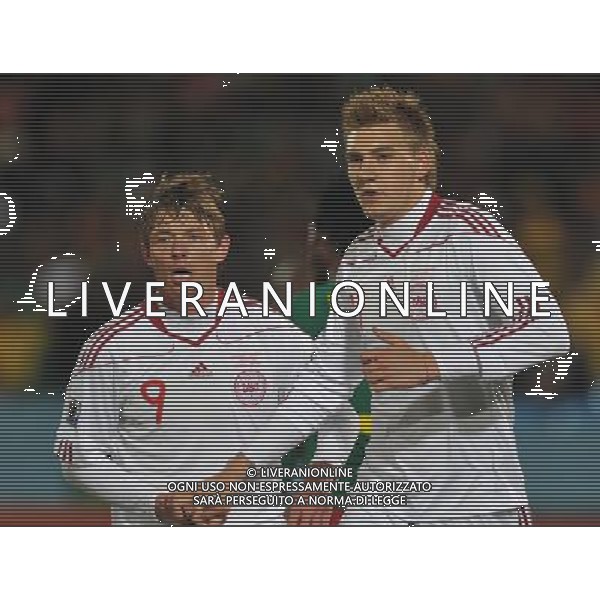 (100620) -- TSHWANE, June 20, 2010 () --Nicklas Bendtner of Denmark(R) celebrates with teammate Jon Dahl Tomasson after scoring a goal during the 2010 World Cup Group E soccer match against Cameroon at Loftus Verfeld stadium in Tshwane, South Africa, on June 19, 2010. (/Yang Lei)(dl) ©Photoshot/Agenzia Aldo Liverani Sas - ITALY ONLY: CAMERUN - DANIMARCA FIFA WORLD CUP CAMPIONATI MONDIALI SUD AFRICA 2010