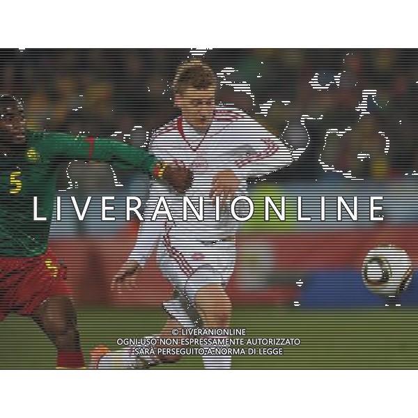 (100620) -- TSHWANE, June 20, 2010 () --Nicklas Bendtner of Denmark (R) vies with Cameroon\'s Sebastien Bassong during the 2010 World Cup Group E soccer match at Loftus Verfeld stadium in Tshwane, South Africa, on June 19, 2010. (/Yang Lei)(dl) ©Photoshot/Agenzia Aldo Liverani Sas - ITALY ONLY: CAMERUN - DANIMARCA FIFA WORLD CUP CAMPIONATI MONDIALI SUD AFRICA 2010