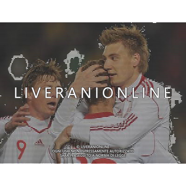 (100620) -- TSHWANE, June 20, 2010 () -- Denmark\'s Nicklas Bendtner (R) celebrates with teammates Dennis Rommedahl (C), Jon Dahl Tomasson after scoring a goal during the 2010 World Cup Group E soccer match against Cameroon at Loftus Verfeld stadium in Tshwane, South Africa, on June 19, 2010. (/Yang Lei)(dl) ©Photoshot/Agenzia Aldo Liverani Sas - ITALY ONLY: CAMERUN - DANIMARCA FIFA WORLD CUP CAMPIONATI MONDIALI SUD AFRICA 2010