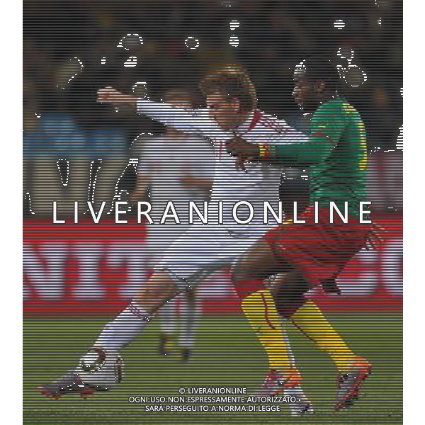 (100620) -- TSHWANE, June 20, 2010 () --Sebastien Bassong of Cameroon(R) vies with Nicklas Bendtner of Denmark during their 2010 World Cup Group E soccer match at Loftus Verfeld stadium in Tshwane, South Africa, on June 19, 2010. (/Yang Lei)(fym) ©Photoshot/Agenzia Aldo Liverani Sas - ITALY ONLY: CAMERUN - DANIMARCA FIFA WORLD CUP CAMPIONATI MONDIALI SUD AFRICA 2010