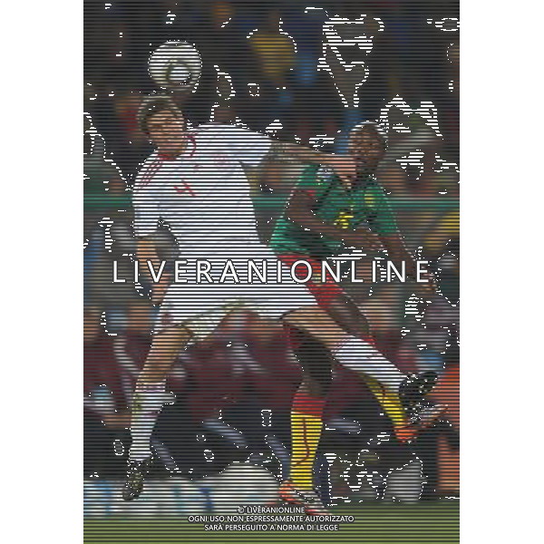 (100620) -- TSHWANE, June 20, 2010 () -- Cameroon\'s Pierre Webo (R) vies with Denmark\'s Daniel Agger during their 2010 World Cup Group E soccer match at Loftus Versfeld stadium in Tshwane, South Africa, June 19, 2010. (/Wang Yuguo) (ly) ©Photoshot/Agenzia Aldo Liverani Sas - ITALY ONLY: CAMERUN - DANIMARCA FIFA WORLD CUP CAMPIONATI MONDIALI SUD AFRICA 2010