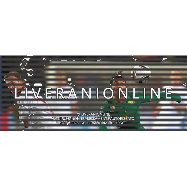 (100620) -- TSHWANE, June 20, 2010 () --Benoit Assou-Ekotto of Cameroon(R) breaks through during the 2010 World Cup Group E soccer match against Denmark at Loftus Verfeld stadium in Tshwane, South Africa, on June 19, 2010. (/Yang Lei)(fym) ©Photoshot/Agenzia Aldo Liverani Sas - ITALY ONLY: CAMERUN - DANIMARCA FIFA WORLD CUP CAMPIONATI MONDIALI SUD AFRICA 2010