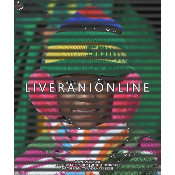 (100620) -- TSHWANE, June 20, 2010 () -- A baby fan cheers for Cameroon prior to the 2010 World Cup Group E soccer match between Cameroon and Denmark at Loftus Verfeld stadium in Tshwane, South Africa, on June 19, 2010. (/Yang Lei)(dl) ©Photoshot/Agenzia Aldo Liverani Sas - ITALY ONLY: CAMERUN - DANIMARCA FIFA WORLD CUP CAMPIONATI MONDIALI SUD AFRICA 2010