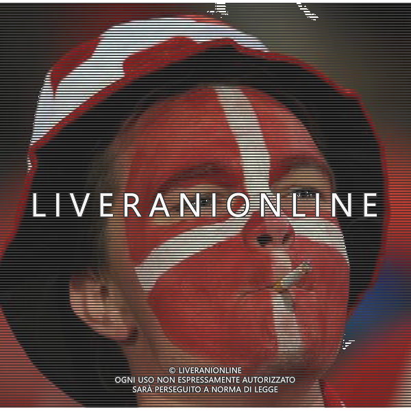 (100620) -- TSHWANE, June 20, 2010 () -- A fan smokes prior to the 2010 World Cup Group E soccer match between Cameroon and Denmark at Loftus Versfeld stadium in Tshwane, South Africa, June 19, 2010. (/Wang Yuguo) (ly) ©Photoshot/Agenzia Aldo Liverani Sas - ITALY ONLY: CAMERUN - DANIMARCA FIFA WORLD CUP CAMPIONATI MONDIALI SUD AFRICA 2010