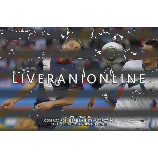 U.S.\' Steve CHERUNDOLO (L) vies for the ball with Slovenia\'s Andraz KIRM (R) during the World Cup group C soccer match between USA and Slovenia in Johannesburg in South Africa on Friday, June 18, 2010. The match ended in a 2-2 draw.(Photo By Wei Zheng/ColorChinaPhoto) - Ag. Aldo Liverani sas ITALY ONLY SLOVENIA - STATI UNITI FIFA WORLD CUP CAMPIONATI MONDIALI SUD AFRICA 2010