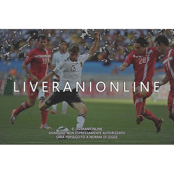 (100618) -- PORT ELIZABETH, June 18, 2010 -- Germany\'s Thomas Muller (2nd L) shoots during the 2010 World Cup Group D soccer match against Serbia at the Nelson Mandela Bay stadium in Port Elizabeth, South Africa, on June 18, 2010. Germany lost the match 0-1. Yang Lei) (zc) ©Photoshot/Agenzia Aldo Liverani Sas - ITALY ONLY: GERMANIA - SERBIA FIFA WORLD CUP CAMPIONATI MONDIALI SUD AFRICA 2010