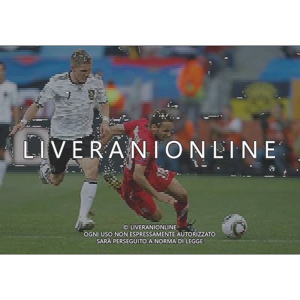 (100618) -- PORT ELIZABETH, June 18, 2010 -- Germany\'s Bastian Schweinsteiger (L) vies with Serbia\'s Milos Ninkovic during the 2010 World Cup Group D soccer match between Germany and Serbia at the Nelson Mandela Bay stadium in Port Elizabeth, South Africa, on June 18, 2010. Liao Yujie) ©Photoshot/Agenzia Aldo Liverani Sas - ITALY ONLY: GERMANIA - SERBIA FIFA WORLD CUP CAMPIONATI MONDIALI SUD AFRICA 2010