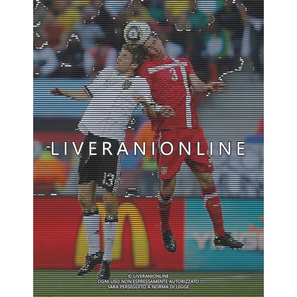 (100618) -- PORT ELIZABETH, June 18, 2010 -- Serbia\'s Aleksandar Kolarov (R) fights for the ball with Germany\'s Thomas Muller during the 2010 World Cup Group D soccer match between Germany and Serbia at the Nelson Mandela Bay stadium in Port Elizabeth, South Africa, on June 18, 2010. Liao Yujie) (zc) ©Photoshot/Agenzia Aldo Liverani Sas - ITALY ONLY: GERMANIA - SERBIA FIFA WORLD CUP CAMPIONATI MONDIALI SUD AFRICA 2010