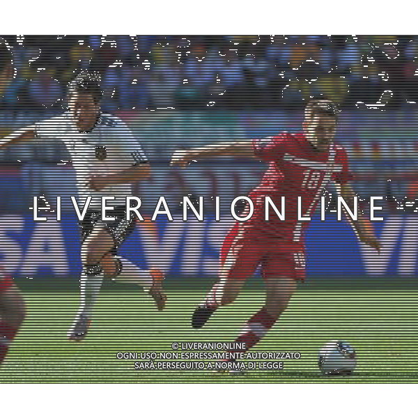 (100618) -- PORT ELIZABETH, Jun. 18, 2010 -- Germany\'s Mesut Ozil (L) vies with Serbia\'s Milos Ninkovic during the 2010 World Cup Group D soccer match between Germany and Serbia at the Nelson Mandela Bay stadium in Port Elizabeth, South Africa, on June 18, 2010. Yang Lei) (zc) ©Photoshot/Agenzia Aldo Liverani Sas - ITALY ONLY: GERMANIA - SERBIA FIFA WORLD CUP CAMPIONATI MONDIALI SUD AFRICA 2010