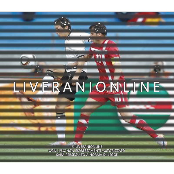 (100618) -- PORT ELIZABETH, June 18, 2010 -- Germany\'s Mesut Ozil (L) vies with Serbia\'s Dejan Stankovic during the 2010 World Cup Group D soccer match between Germany and Serbia at the Nelson Mandela Bay stadium in Port Elizabeth, South Africa, on June 18, 2010. Liao Yujie) (zc) ©Photoshot/Agenzia Aldo Liverani Sas - ITALY ONLY: GERMANIA - SERBIA FIFA WORLD CUP CAMPIONATI MONDIALI SUD AFRICA 2010
