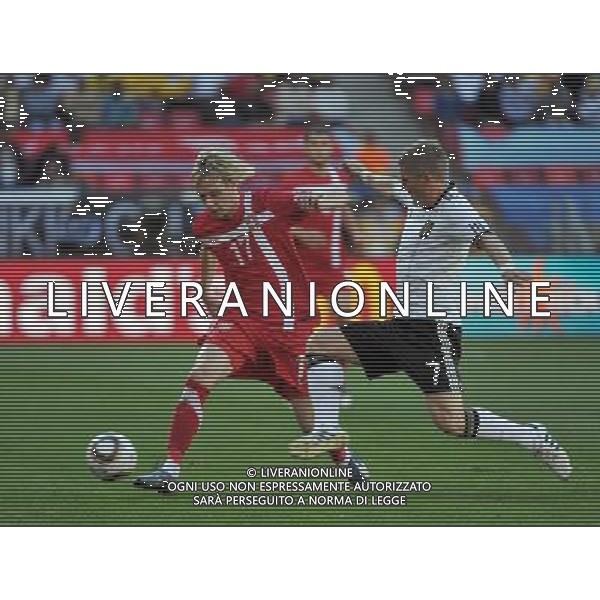 (100618) -- PORT ELIZABETH, June 18, 2010 -- Germany\'s Bastian Schweinsteiger (R) tackles Serbia\'s Milos Krasic during the 2010 World Cup Group D soccer match between Germany and Serbia at the Nelson Mandela Bay stadium in Port Elizabeth, South Africa, on June 18, 2010. Yang Lei) ©Photoshot/Agenzia Aldo Liverani Sas - ITALY ONLY: GERMANIA - SERBIA FIFA WORLD CUP CAMPIONATI MONDIALI SUD AFRICA 2010