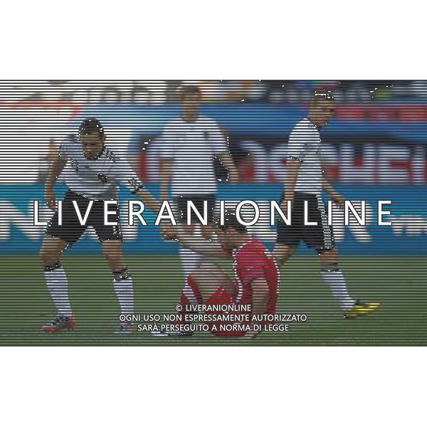 (100618) -- PORT ELIZABETH, June 18, 2010 -- Germany\'s Miroslav Klose (L) helps a player of Serbia during the 2010 World Cup Group D soccer match between Germany and Serbia at the Nelson Mandela Bay stadium in Port Elizabeth, South Africa, on June 18, 2010. Liao Yujie) (zc) ©Photoshot/Agenzia Aldo Liverani Sas - ITALY ONLY: GERMANIA - SERBIA FIFA WORLD CUP CAMPIONATI MONDIALI SUD AFRICA 2010