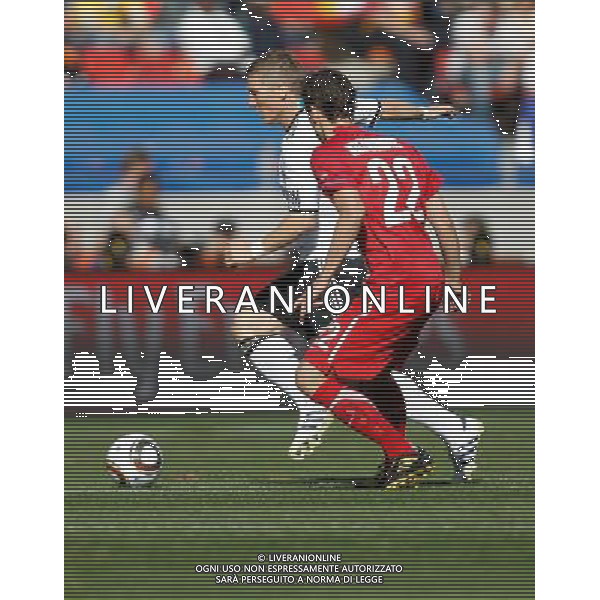 (100618) -- PORT ELIZABETH, June 18, 2010 -- Germany\'s Bastian Schweinsteiger (L) vies with Serbia\'s Zdravko Kuzmanovic during the 2010 World Cup Group D soccer match between Germany and Serbia at the Nelson Mandela Bay stadium in Port Elizabeth, South Africa, on June 18, 2010. Liao Yujie) (zc) ©Photoshot/Agenzia Aldo Liverani Sas - ITALY ONLY: GERMANIA - SERBIA FIFA WORLD CUP CAMPIONATI MONDIALI SUD AFRICA 2010