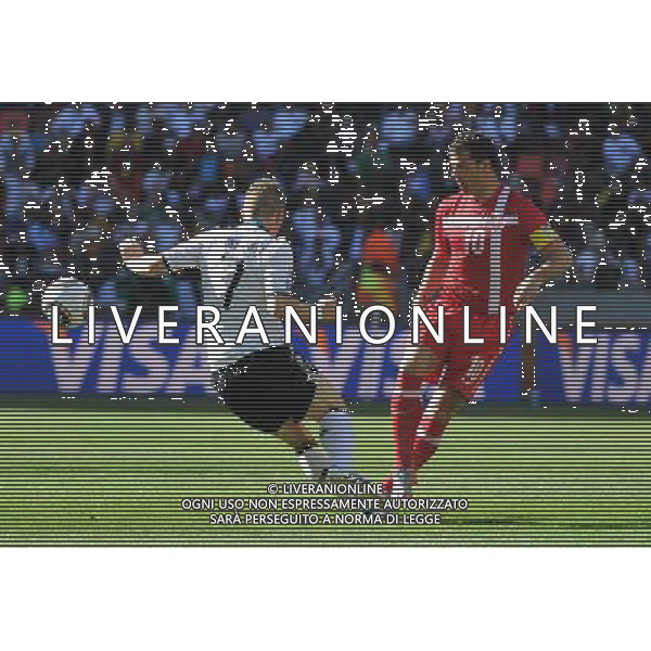 (100618) -- PORT ELIZABETH, June 18, 2010 -- Germany\'s Bastian Schweinsteiger (L) vies with Serbia\'s Dejan Stankovic during the 2010 World Cup Group D soccer match between Germany and Serbia at the Nelson Mandela Bay stadium in Port Elizabeth, South Africa, on June 18, 2010. Yang Lei) ©Photoshot/Agenzia Aldo Liverani Sas - ITALY ONLY: GERMANIA - SERBIA FIFA WORLD CUP CAMPIONATI MONDIALI SUD AFRICA 2010