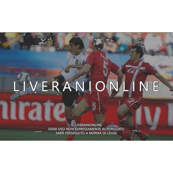 (100618) -- PORT ELIZABETH, June 18, 2010 -- Germany\'s Sami Khedira (L) vies with players of Serbia during the 2010 World Cup Group D soccer match between Germany and Serbia at the Nelson Mandela Bay stadium in Port Elizabeth, South Africa, on June 18, 2010. Liao Yujie) (zc) ©Photoshot/Agenzia Aldo Liverani Sas - ITALY ONLY: GERMANIA - SERBIA FIFA WORLD CUP CAMPIONATI MONDIALI SUD AFRICA 2010