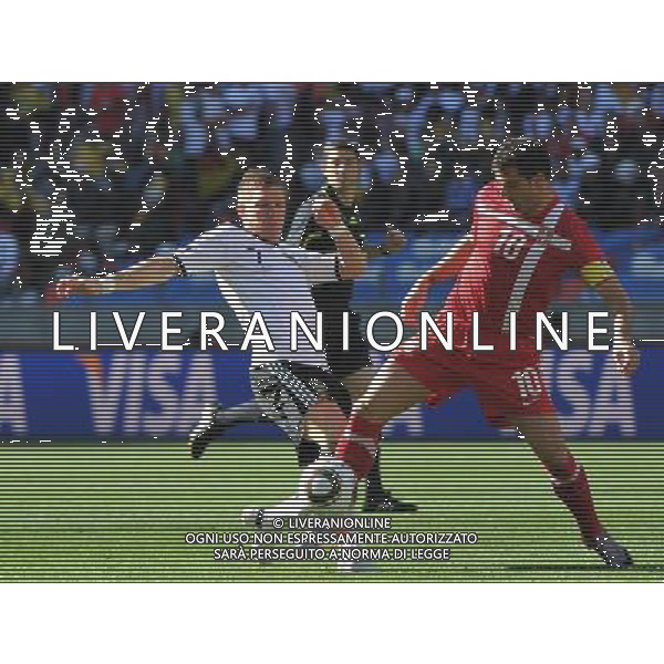 (100618) -- PORT ELIZABETH, June 18, 2010 -- Germany\'s Bastian Schweinsteiger (L) vies with Serbia\'s Dejan Stankovic during the 2010 World Cup Group D soccer match between Germany and Serbia at the Nelson Mandela Bay stadium in Port Elizabeth, South Africa, on June 18, 2010.Yang Lei) (zc) ©Photoshot/Agenzia Aldo Liverani Sas - ITALY ONLY: GERMANIA - SERBIA FIFA WORLD CUP CAMPIONATI MONDIALI SUD AFRICA 2010