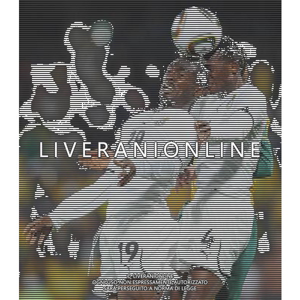 (100619) -- RUSTENBURG, June 19, 2010 () -- Ghana\'s Lee Addy (L) and John Pantsil jump for a head ball during the 2010 World Cup Group D football match against Australia at Royal Bafokeng stadium in Rustenburg, South Africa, on June 19, 2010. The match tied 1-1. (/Li Ga)(kh) ©Photoshot/Agenzia Aldo Liverani Sas - ITALY ONLY: GHANA - AUSTRALIA FIFA WORLD CUP CAMPIONATI MONDIALI SUD AFRICA 2010