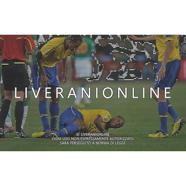 (100621) -- JOHANNESBURG, June 21, 2010 () -- Michel Bastos of Brazil (bottom) lies on the ground during the Group G soccer match against Ivory Coast at 2010 FIFA World Cup at Soccer City stadium in Johannesburg, South Africa, on June 20, 2010. Brazil won 3-1. (/Yang Lei)(xm) ©Photoshot/Agenzia Aldo Liverani Sas - ITALY ONLY: BRASILE - COSTA D\'AVORIO FIFA WORLD CUP CAMPIONATI MONDIALI SUD AFRICA 2010