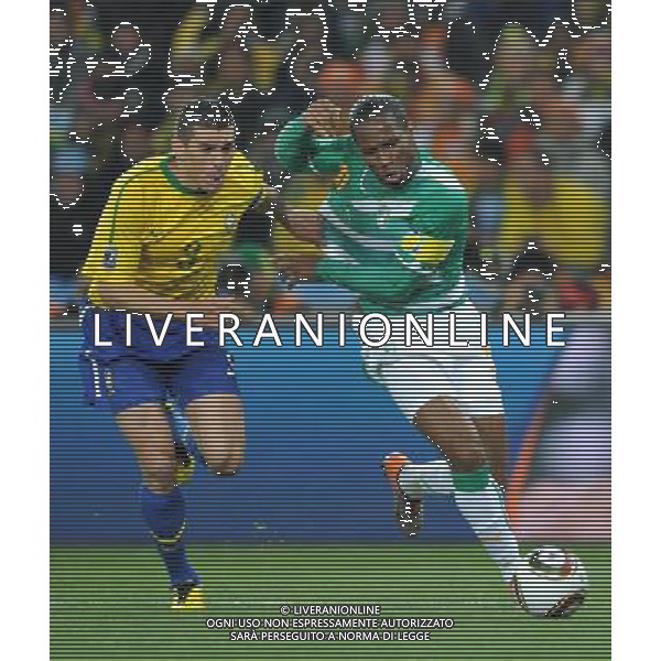 (100621) -- JOHANNESBURG, June 21, 2010 () -- Lucio of Brazil(L) fights for the ball with Didier Drogba of Ivory Coast during their Group G soccer match at 2010 FIFA World Cup at Soccer City stadium in Johannesburg, South Africa, on June 20, 2010. Brazil won 3-1. (/Yang Lei)(xm) ©Photoshot/Agenzia Aldo Liverani Sas - ITALY ONLY: BRASILE - COSTA D\'AVORIO FIFA WORLD CUP CAMPIONATI MONDIALI SUD AFRICA 2010