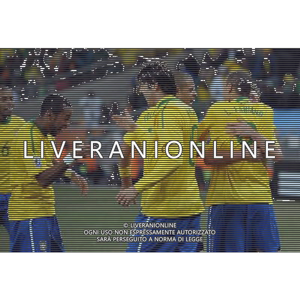 (100621) -- JOHANNESBURG, June 21, 2010 () -- Players of Brazil celebrate a goal during the Group G soccer match against Ivory Coast at 2010 FIFA World Cup at Soccer City stadium in Johannesburg, South Africa, on June 20, 2010. Brazil won 3-1. (/Wang Yuguo)(xm) ©Photoshot/Agenzia Aldo Liverani Sas - ITALY ONLY: BRASILE - COSTA D\'AVORIO FIFA WORLD CUP CAMPIONATI MONDIALI SUD AFRICA 2010