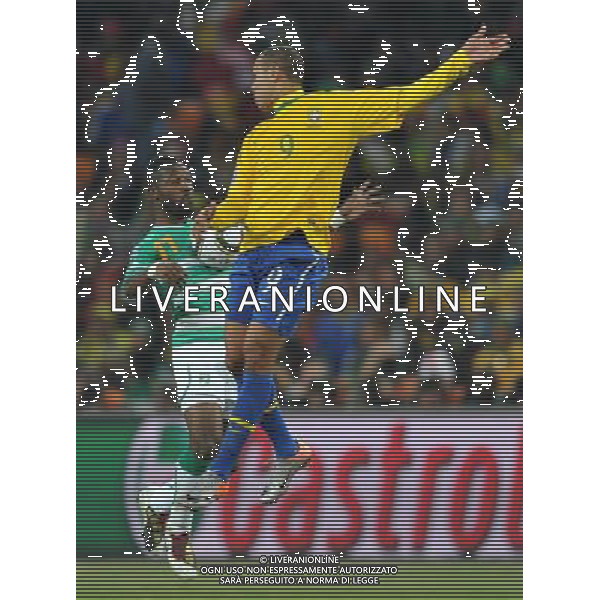 (100621) -- JOHANNESBURG, June 21, 2010 () -- Luis Fabiano of Brazil(R) fights for the ball with Siaka Tiene of Ivory Coast during their Group G soccer match at 2010 FIFA World Cup at Soccer City stadium in Johannesburg, South Africa, on June 20, 2010. Brazil won 3-1. (/Yang Lei)(xm) ©Photoshot/Agenzia Aldo Liverani Sas - ITALY ONLY: BRASILE - COSTA D\'AVORIO FIFA WORLD CUP CAMPIONATI MONDIALI SUD AFRICA 2010