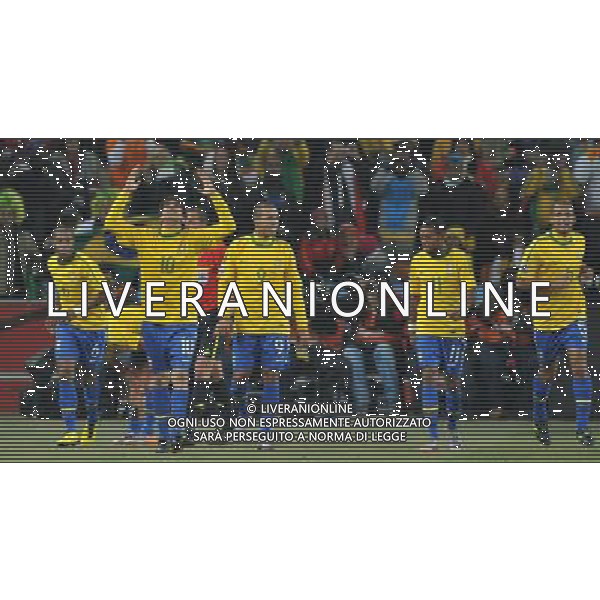 (100621) -- JOHANNESBURG, June 21, 2010 () -- Players of Brazil celebrate the third goal during the Group G soccer match against Ivory Coast at 2010 FIFA World Cup at Soccer City stadium in Johannesburg, South Africa, on June 20, 2010. Brazil won 3-1. (/Yang Lei)(xm) ©Photoshot/Agenzia Aldo Liverani Sas - ITALY ONLY: BRASILE - COSTA D\'AVORIO FIFA WORLD CUP CAMPIONATI MONDIALI SUD AFRICA 2010