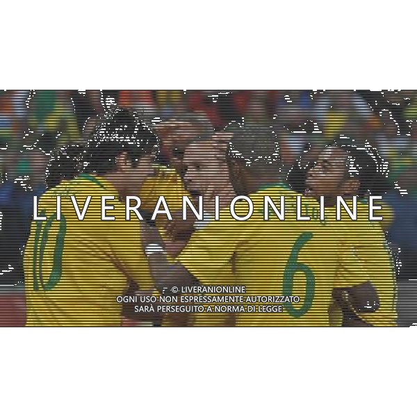 (100621) -- JOHANNESBURG, June 21, 2010 () -- Luis Fabiano of Brazil(C) is congratulated by teammates for his openning goal during the Group G soccer match against Ivory Coast at 2010 FIFA World Cup at Soccer City stadium in Johannesburg, South Africa, on June 20, 2010. (/Yang Lei)(xm) ©Photoshot/Agenzia Aldo Liverani Sas - ITALY ONLY: BRASILE - COSTA D\'AVORIO FIFA WORLD CUP CAMPIONATI MONDIALI SUD AFRICA 2010