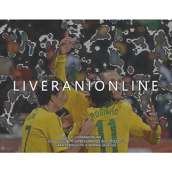 (100621) -- JOHANNESBURG, June 21, 2010 () -- Luis Fabiano of Brazil(R) celebrates the opening goal with teammates during the Group G soccer match against Ivory Coast at 2010 FIFA World Cup at Soccer City stadium in Johannesburg, South Africa, on June 20, 2010. (/Yang Lei) ©Photoshot/Agenzia Aldo Liverani Sas - ITALY ONLY: BRASILE - COSTA D\'AVORIO FIFA WORLD CUP CAMPIONATI MONDIALI SUD AFRICA 2010