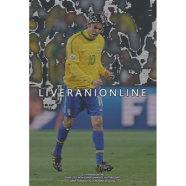 (100621) -- JOHANNESBURG, June 21, 2010 () -- Kaka of Brazil celebrates the opening goal by his teammate Luis Fabiano during the Group G soccer match against Ivory Coast at 2010 FIFA World Cup at Soccer City stadium in Johannesburg, South Africa, on June 20, 2010. (/Wang Yuguo)(xm) ©Photoshot/Agenzia Aldo Liverani Sas - ITALY ONLY: BRASILE - COSTA D\'AVORIO FIFA WORLD CUP CAMPIONATI MONDIALI SUD AFRICA 2010