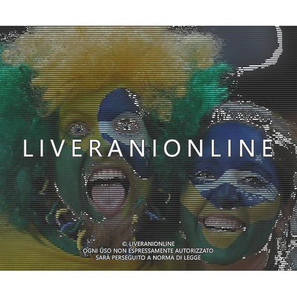 (100621) -- JOHANNESBURG, June 21, 2010 () -- Brazilian supporters pose for grimaces before the Group G soccer match against Ivory Coast at 2010 FIFA World Cup at Soccer City stadium in Johannesburg, South Africa, on June 20, 2010. (/Wang Yuguo)(xm) ©Photoshot/Agenzia Aldo Liverani Sas - ITALY ONLY: BRASILE - COSTA D\'AVORIO FIFA WORLD CUP CAMPIONATI MONDIALI SUD AFRICA 2010