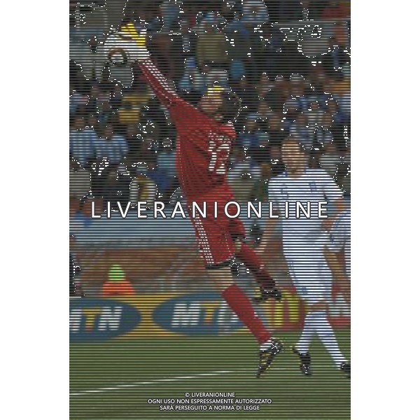 (100623) -- POLOKWANE, June 23, 2010 -- Greece\'s goalkeeper Alexandros Tzorvas (L) jumps to save the ball during the 2010 World Cup Group B soccer match against Argentina in Polokwane, South Africa, June 22, 2010. Xu Suhui) ©Photoshot/Agenzia Aldo Liverani Sas - ITALY ONLY: ARGENTINA - GRECIA FIFA WORLD CUP CAMPIONATI MONDIALI SUD AFRICA 2010