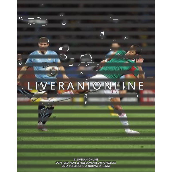(100622) -- RUSTENBURG, June 22, 2010 -- Javier Hernandez of Mexico (R) vies with a player of Uruguay during their 2010 World Cup Group A soccer match at Royal Bafokeng Stadium in Rustenburg, South Africa, on June 22, 2010. Uruguay won 1-0 and both teams qualify for the next round. Guo Yong)(fym) ©Photoshot/Agenzia Aldo Liverani Sas - ITALY ONLY: URUGUAY - MESSICO FIFA WORLD CUP CAMPIONATI MONDIALI SUD AFRICA 2010