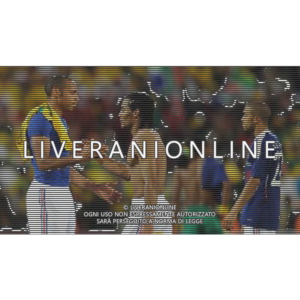 (100622) -- BLOEMFONTEIN, June 22, 2010 -- France\'s Thierry Henry (L) shakes hands with his teammate Florent Malouda after the Group A match between France and South Africa at the 2010 World Cup football match in Bloemfontein, South Africa, on June 22, 2010. France lost the match 1-2. Li Ga) (zc)