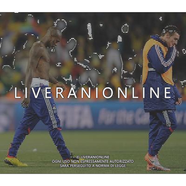 (100622) -- BLOEMFONTEIN, June 22, 2010 -- France\'s Djibril Cisse (L) and his teammate walk out of the court after the Group A match between France and South Africa at the 2010 World Cup football match in Bloemfontein, South Africa, on June 22, 2010. France lost the match 1-2. Li Ga) (zc) 