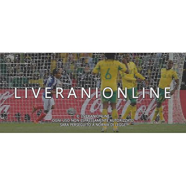 (100622) -- BLOEMFONTEIN, June 22, 2010 -- France\'s Florent Malouda (L) scores a goal during the Group A match between France and South Africa at the 2010 World Cup football match in Bloemfontein, South Africa, on June 22, 2010. France lost the match 1-2. Li Ga) (zc)