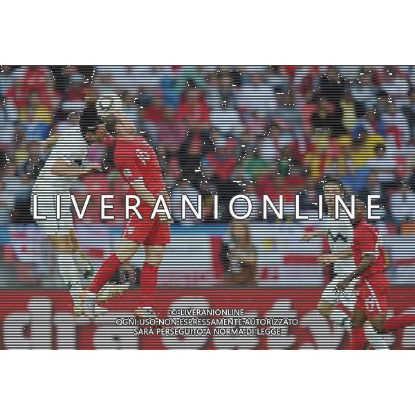 (100623) -- PORT ELIZABETH, June 23, 2010 -- England\'s Wayne Rooney (2nd L) vies for the ball during the 2010 World Cup Group C soccer match against Slovenia at Nelson Mandela Bay stadium in Port Elizabeth, South Africa, June 23, 2010. Yang Lei) (kh) ©Photoshot/Agenzia Aldo Liverani Sas - ITALY ONLY: INGHILTERRA - SLOVENIA FIFA WORLD CUP CAMPIONATI MONDIALI SUD AFRICA 2010